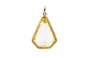 A kite shape yellow glass pendant set in 22 carat yellow gold
