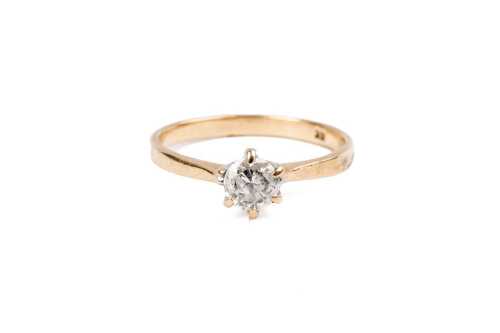 A diamond solitaire ring in 18 carat yellow gold
