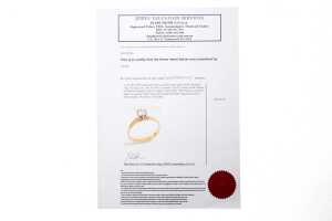A diamond solitaire ring in 18ct yellow and white gold - 6