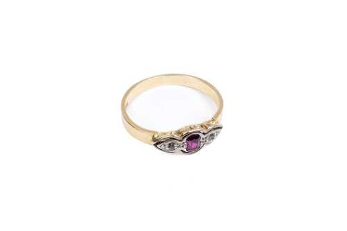 A ruby and diamond ring in 18 carat yellow gold