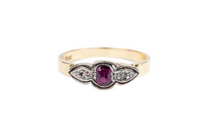 A ruby and diamond ring in 18 carat yellow gold