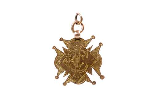 An antique cycling medallion in 9 carat yellow gold