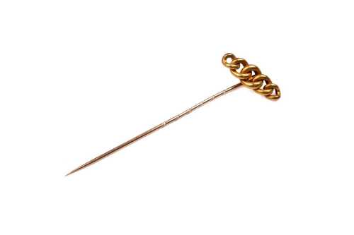 A vintage stick pin in 14 carat yellow gold