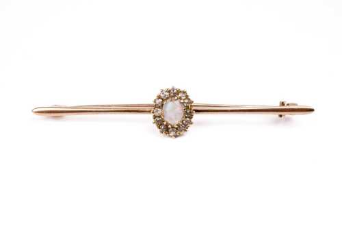 An antique opal and diamond brooch in 15 carat yellow gold