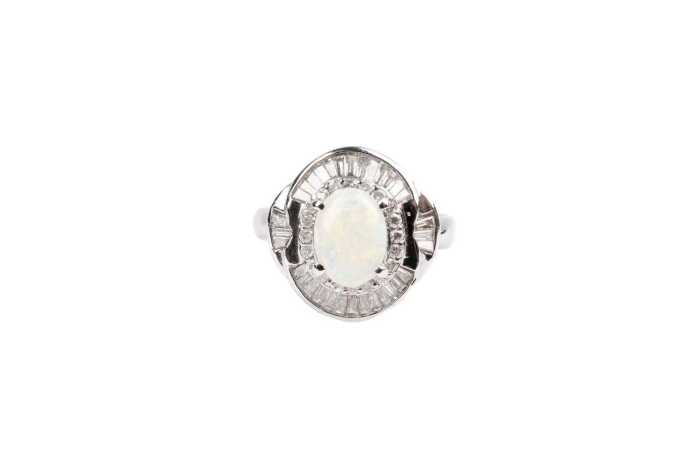 An opal and diamond ring in platinum