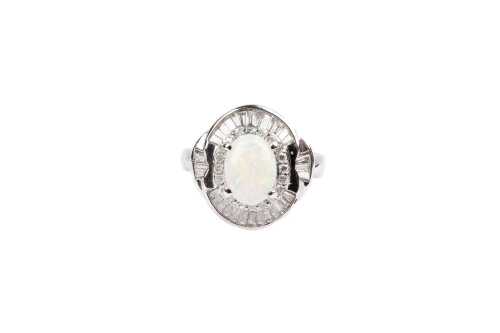 An opal and diamond ring in platinum