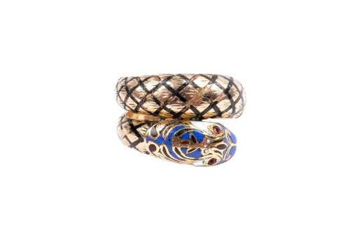 A vintage enamel and red paste snake ring in 14 carat yellow gold