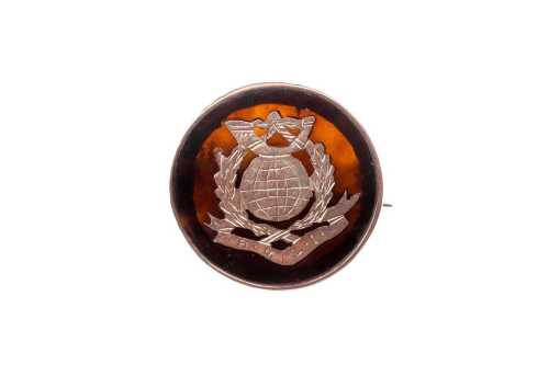 A Royal Light Infantry brooch in tortoise shell and 9 carat rose gold.