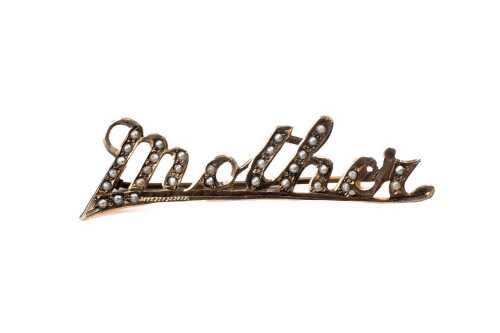 An antique seed pearl "Mother" brooch in 9 carat yellow gold