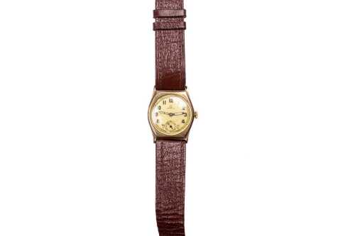 A vintage Omega watch in 9 carat yellow gold case