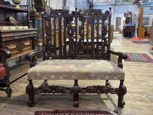 Jacobean style walnut two seat settee