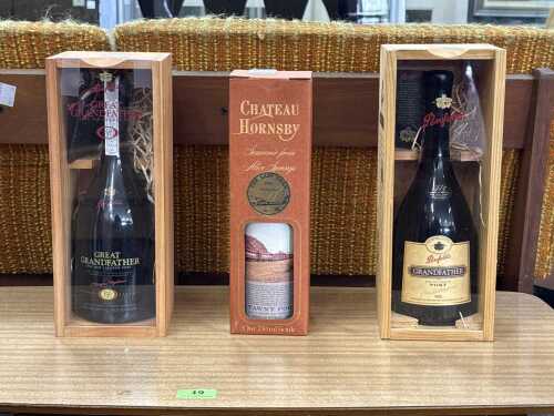 Three bottles of port in presentation boxes