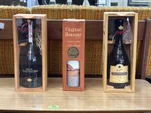 Three bottles of port in presentation boxes