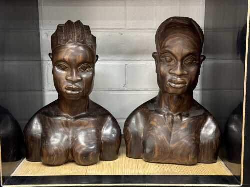 Hand-carved timber busts of African figures