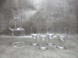 Four Orrefors London glasses with a contemporary water jug
