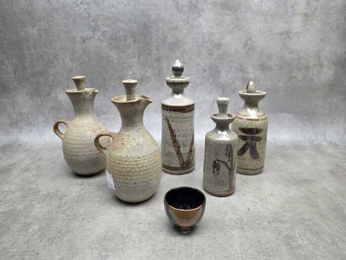 Studio pottery cruet sets, together with drip glaze tea bowl