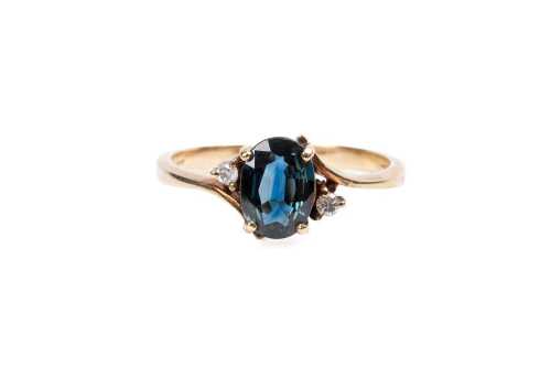 A sapphire and diamond ring in 9 carat yellow gold