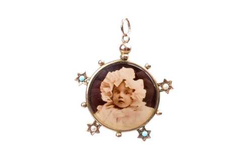 An antique turquoise and seed pearl photo pendant in 9 carat yellow gold