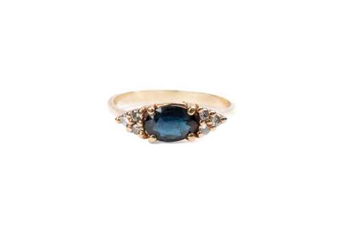A sapphire and diamond ring in 9 carat yellow gold