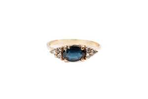 A sapphire and diamond ring in 9 carat yellow gold