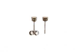 A pair of diamond studs in 18 carat white gold