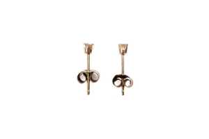 A pair of diamond stud earrings in 9 carat yellow gold
