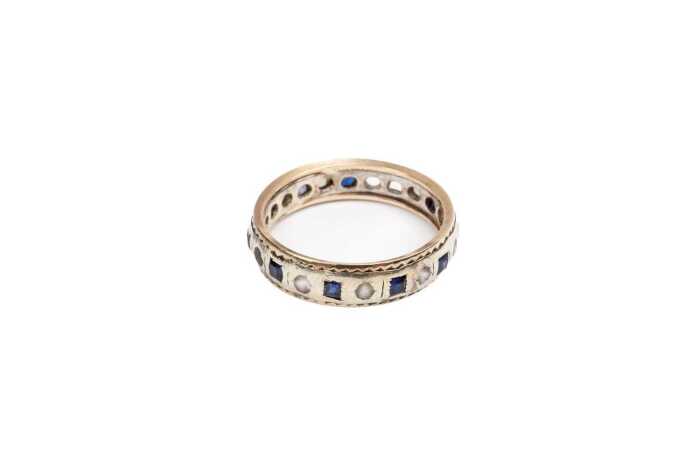 A sapphire and white quartz ring in 9 carat yellow gold