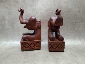 Asian carved timber wall masks and elephant bookends - 2