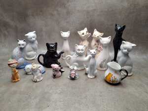 Group of mostly ceramic cat figures
