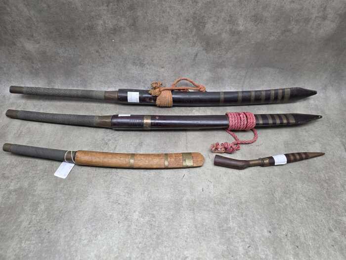 Group of Asian swords and knives. All in original sheaths.