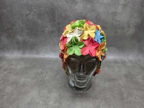 Mid-century glass mannequin head with vintage bathing cap