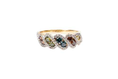 A treated coloured and white diamond ring in 14 carat yellow gold