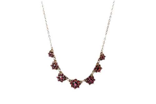 A vintage rolled gold bohemian garnet necklace.