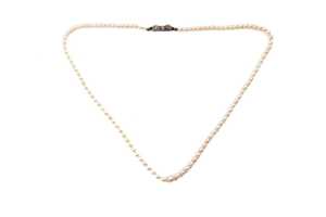 A strand of graduated white cultured pearls to a German 835 silver marcasite clasp.