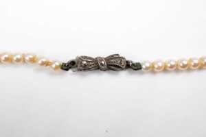 A strand of graduated white cultured pearls to a German 835 silver marcasite clasp. - 4