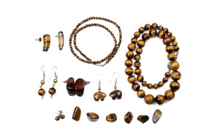 A collection of tiger's eye jewellery and stones