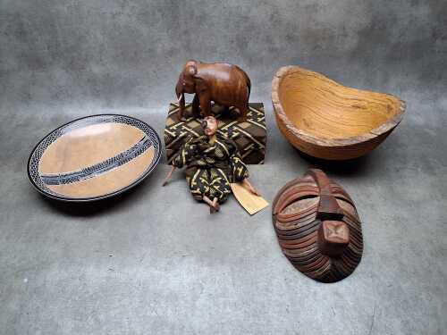 Assorted ethnic decorative items including Congo mask, African soapstone bowl,