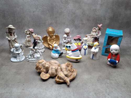 Assorted porcelain figures including cherubs, courting couples, bisque, etc