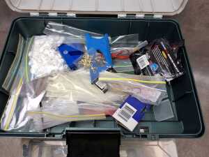 Green hardcase tackle box with tools and fishing accessories - 2