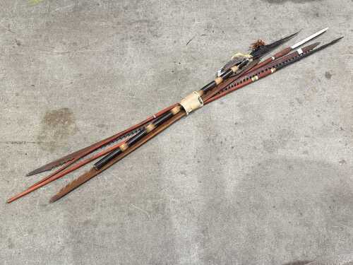 Five decorative tourist ware spears, including Indigenous fishing spears, harpoons, etc.