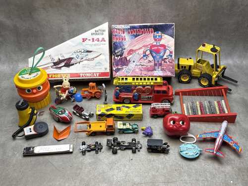 Vintage toys including Tonka forklift, battery operated F14A 'Tomcat' jet fighter, etc.