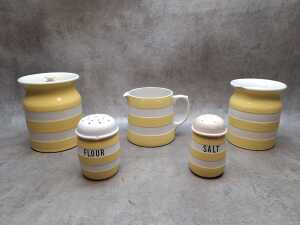 Five yellow and white ceramic Cornish Kitchenware, A/F