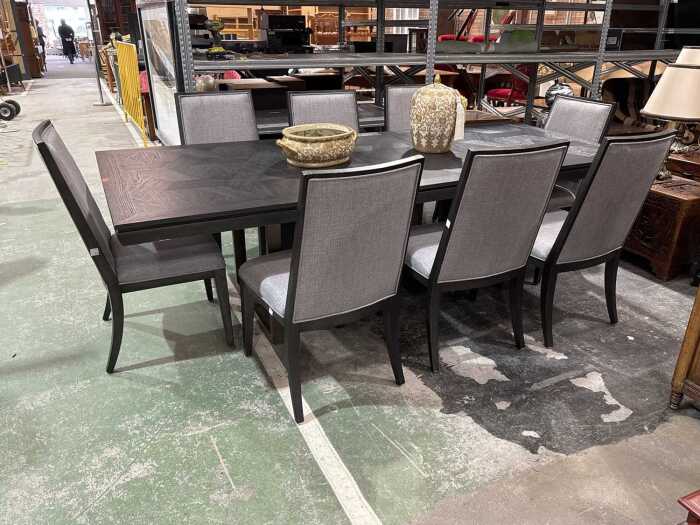 Contemporary black timber nine-piece dining suite