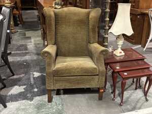 Olive corduroy upholstered wingback armchair