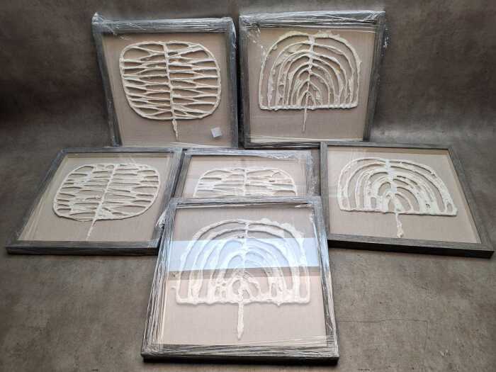 Three pairs of framed paper sculptures titled 'Tribe 1' and 'Tribe 2'