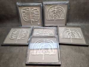 Three pairs of framed paper sculptures titled 'Tribe 1' and 'Tribe 2'