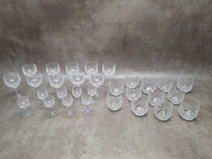 Three sets of cut crystal glasses