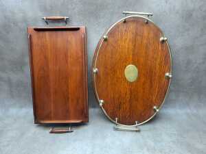 Two early serving trays with metal embellishments