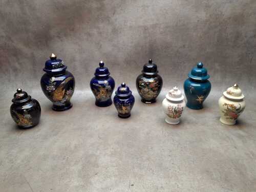 Eight Oriental ginger jars including applied gilt decoration