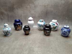Seven Oriental ginger jars including hand-painted, applied gilt, etc.